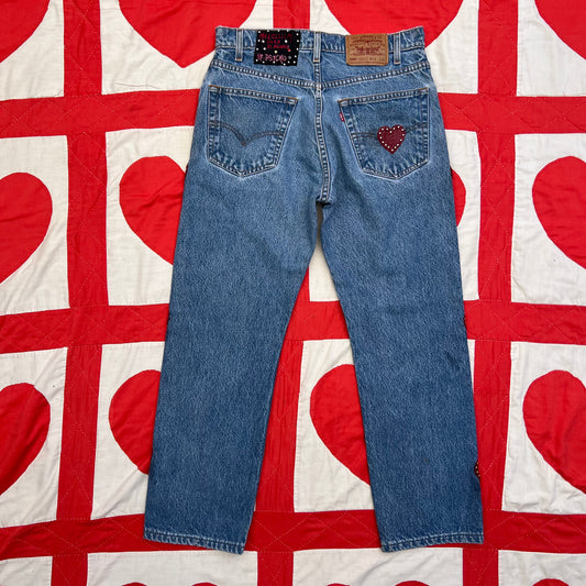 Back of the Custom vintage Levi’s with cut out red leather hearts on each side of the legs. Red cut out heart on the right back pocket