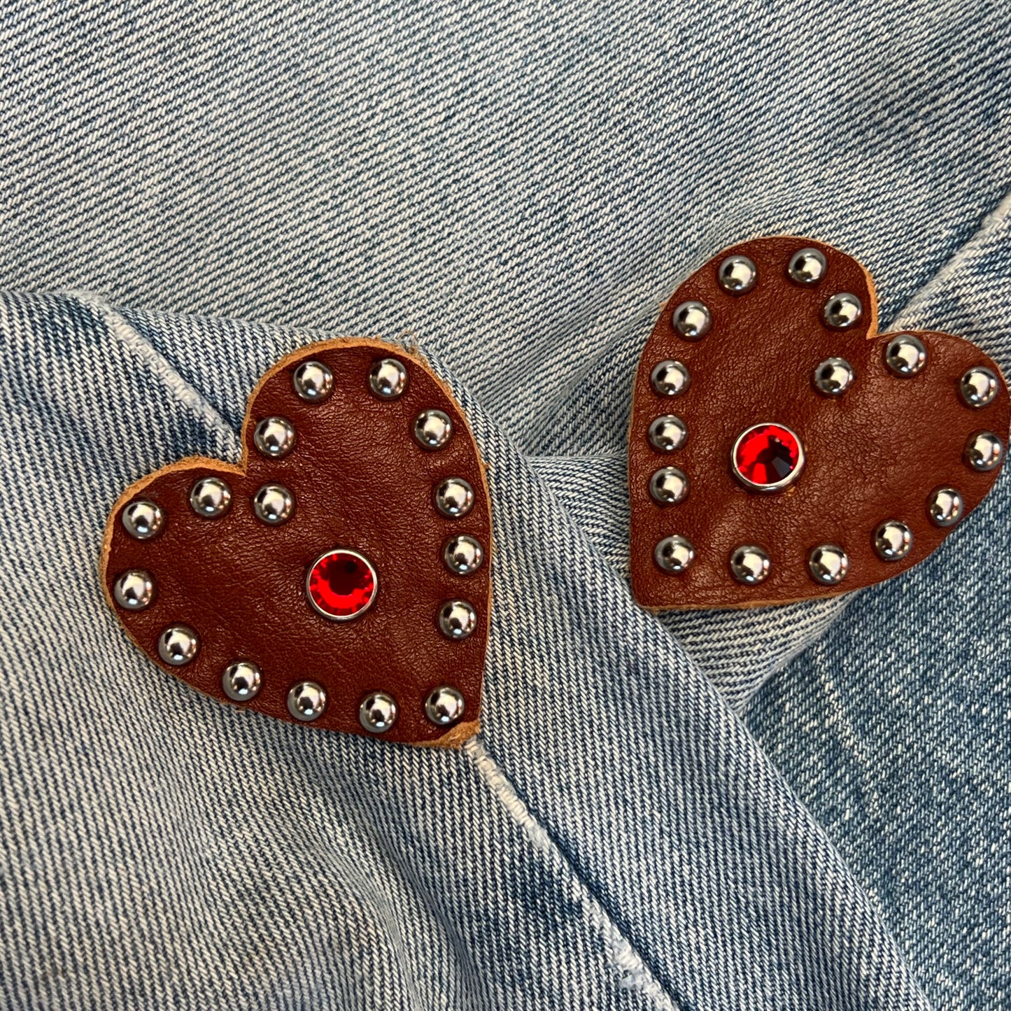Brown hearts with stud work on the side of jean