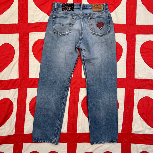 Back of the jeans with Custom vintage Levi’s with cut out red leather hearts on each side of the legs.